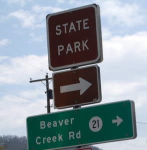 State Park sign in Huntersville, WV directing to Watoga