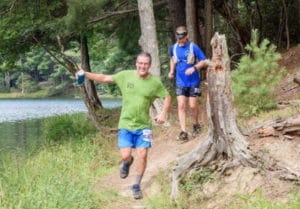 Runners on half marathon course Watoga Mountain Trail Challenge