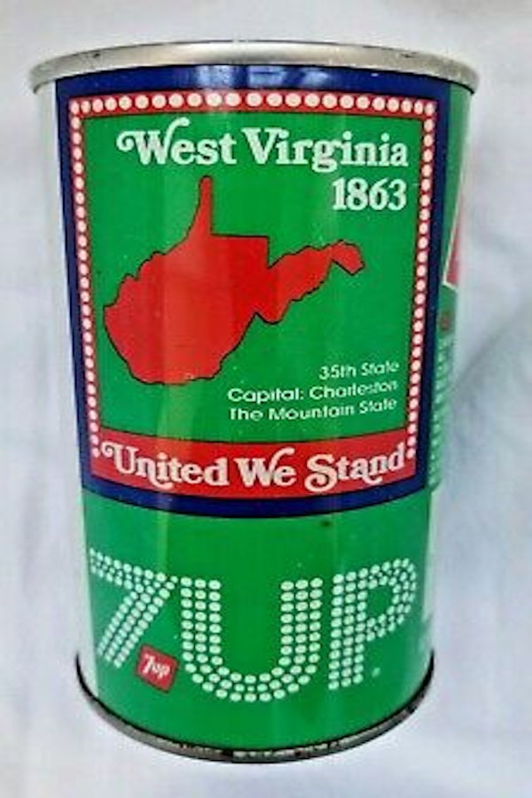 A West Virginia 7 Up cA West Virginia 7 Up can released in advance of the Fourth of July, 1976. Photo courtesy of ebay.comPhoto courtesy of ebay's Image Majick. The name West Virginia is comprised of a square pattern that contains white circular dots blanded over a solid red border. United We Stand is highlighted at the bottom of the square (in white letters) over a red color. The colors are the standard red, white and blue overlaying 7 Up's standard green color.