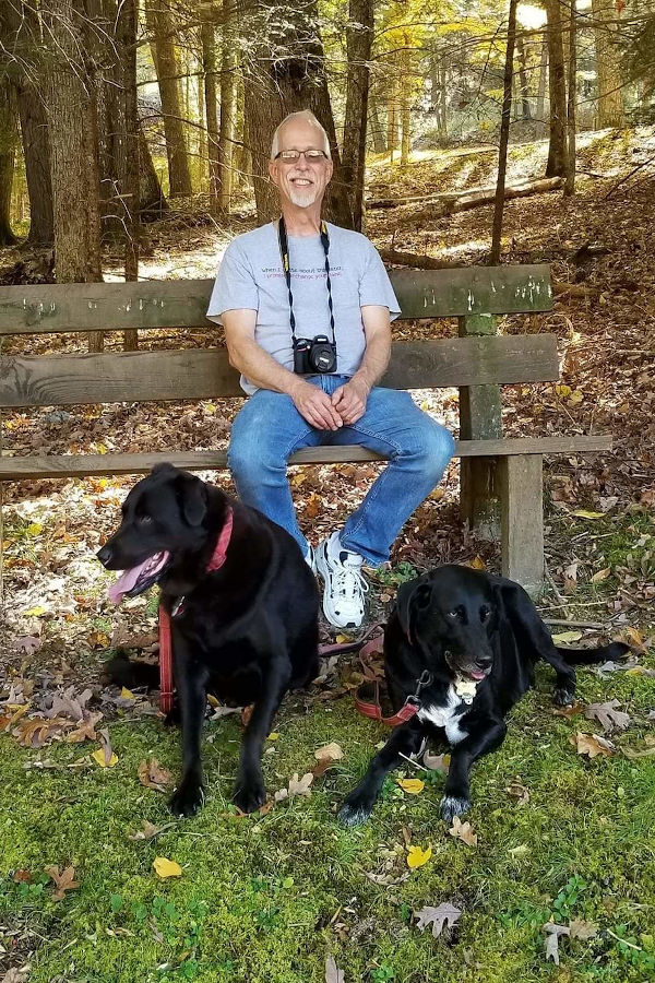 Taking a break to admire the view of the Watoga swimming pool on a 70-degree fall day are John Dean and his two labs, Jack and Max. 📸: Flora Jane Bott, October 7, 2020