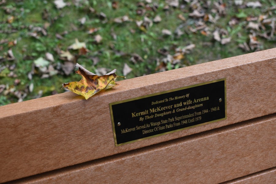 Situated near the CCC statue is Kermit and Arenna McKeever's bench as part of the Watoga State Park Bench Program. 📸: John C. Dean, September 16, 2020