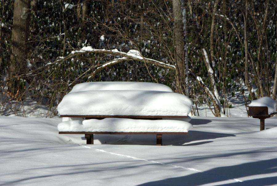 At a picnic table at Watoga, more than 18" of snow pile atop the table. When it snows at Watoga, scenes like this one are common. Photo by Stanley Clark©.