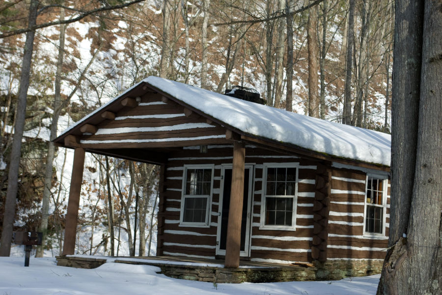 Cabin 1 draped in a layer of snow. Built in the 1930s by the Civilian Conservation Corps, Cabin 1 is across from the Greenbrier River. Photo by Stanley Clark©.