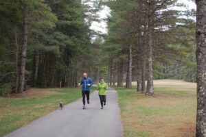 Joggers along road at Beaver Creek Campground. Photo by Watoga State Park Foundation.