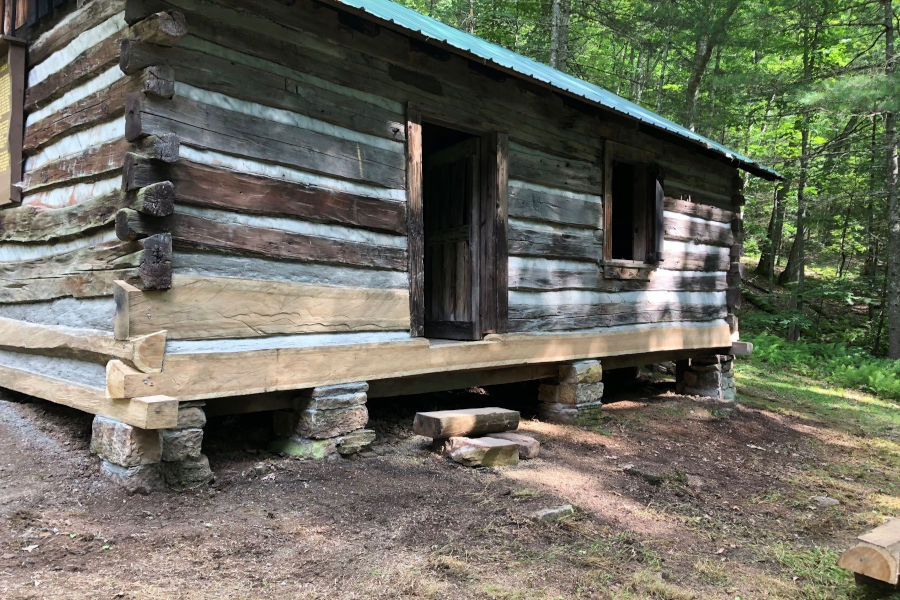 An "after" photo of this log cabin shows the extensive foundation work that was necessary to save this historic cabin from certain ruin. Photo by The Watoga State Park Foundation.